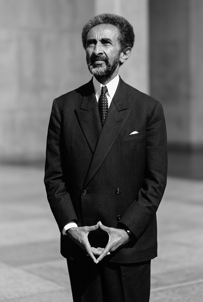 Haile Selassie I — formal portrait, contemplative diamond-hand gesture